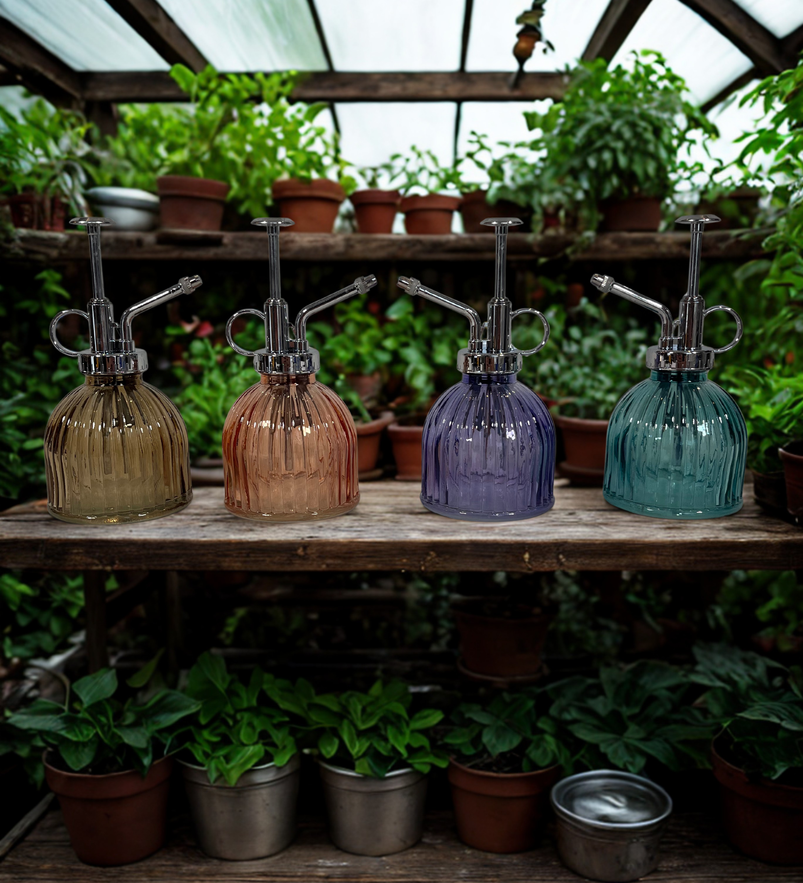 Four glass plant misters on a wooden shelf with plants in the background