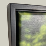 Close-up of a framed picture with a textured background