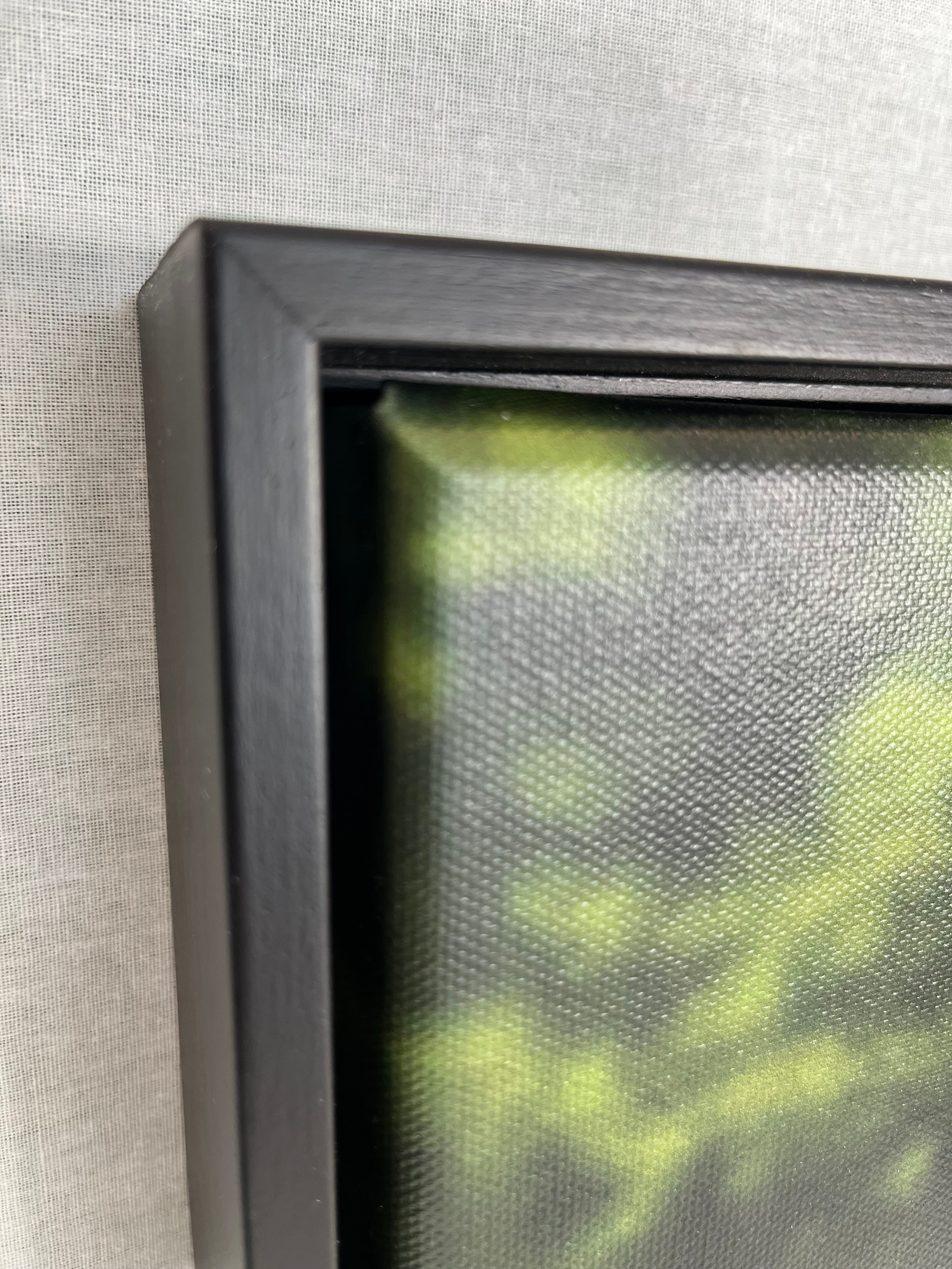 Close-up of a framed picture with a textured background