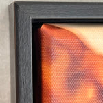 Close-up of the corner details of a photograph with a textured surface and black frame.