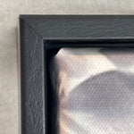 Close-up of a black frame corner on a textured surface 4