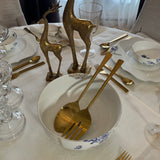 Table setting featuring the Pip Studio Royal White serving bowl with gold plated stainless steel Salad Serving Fork and Spoon.