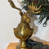 Eugene the Moose Bronze Bust in uniform sporting a monocle with his large antlers and sombre expression. He is a friendly, refined character who brings the charm and whimsical elegance of a storybook into your home.