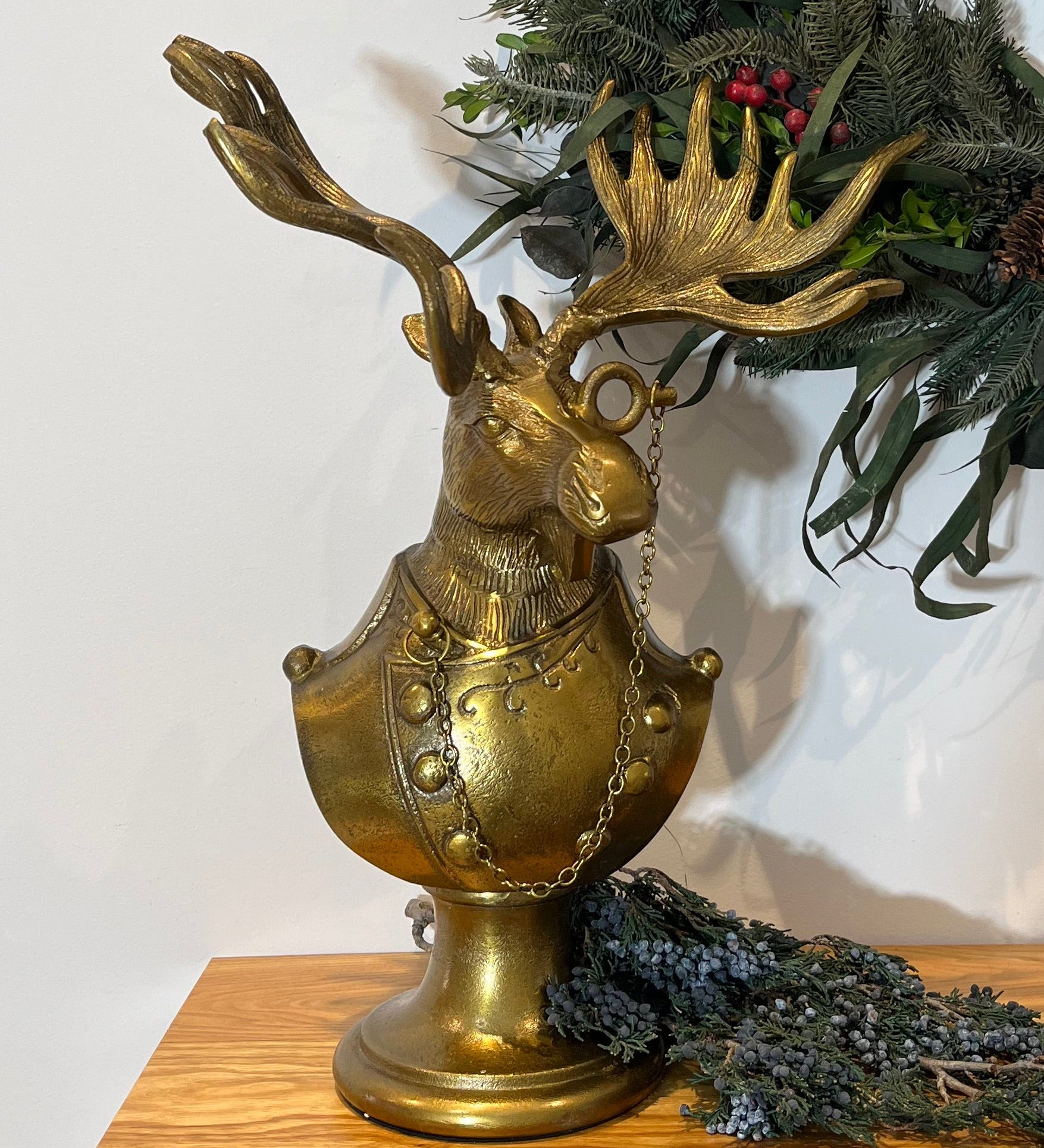 Eugene the Moose Bronze Bust in uniform sporting a monocle with his large antlers and sombre expression. He is a friendly, refined character who brings the charm and whimsical elegance of a storybook into your home.