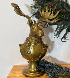 Eugene the Moose Bronze Bust in uniform sporting a monocle with his large antlers and sombre expression. He is a friendly, refined character who brings the charm and whimsical elegance of a storybook into your home.