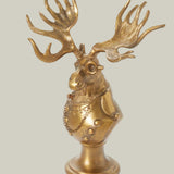 Eugene the Moose Bronze Bust in uniform sporting a monocle with his large antlers and sombre expression. He is a friendly, refined character who brings the charm and whimsical elegance of a storybook into your home.