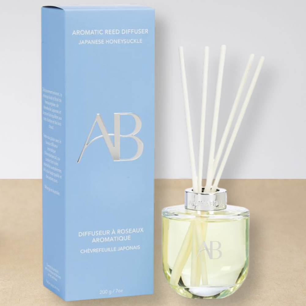 Aromatherapy diffuser with packaging on a beige surface