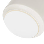 Close-up of the bottom of a white ceramic vase with matte finish and faux leather handle. The bottom has a soft white foam to prevent surface scratches.