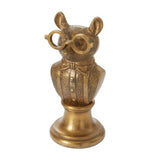 Gold mouse-shaped decorative object wearing glasses on a white background