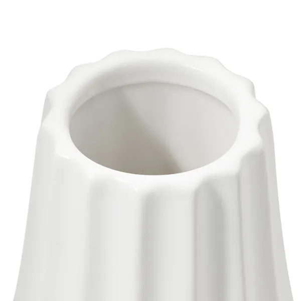 Close-up of a white ceramic vase with a fluted, scalloped rim and vertical fluting on a white background.