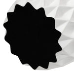 A close-up of a soft surface on the bottom of the vase intended to prevent scratching surfaces.