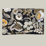 Floral beaded clutch bag on a black background