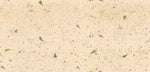 Beige textured surface with scattered small green leaf and fern-like inclusions, shown as a close-up material/pattern sample. 4