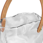 Close-up of the opening of a 9.5 Inch tall clear glass vase shaped like a paper bag with faux leather. 