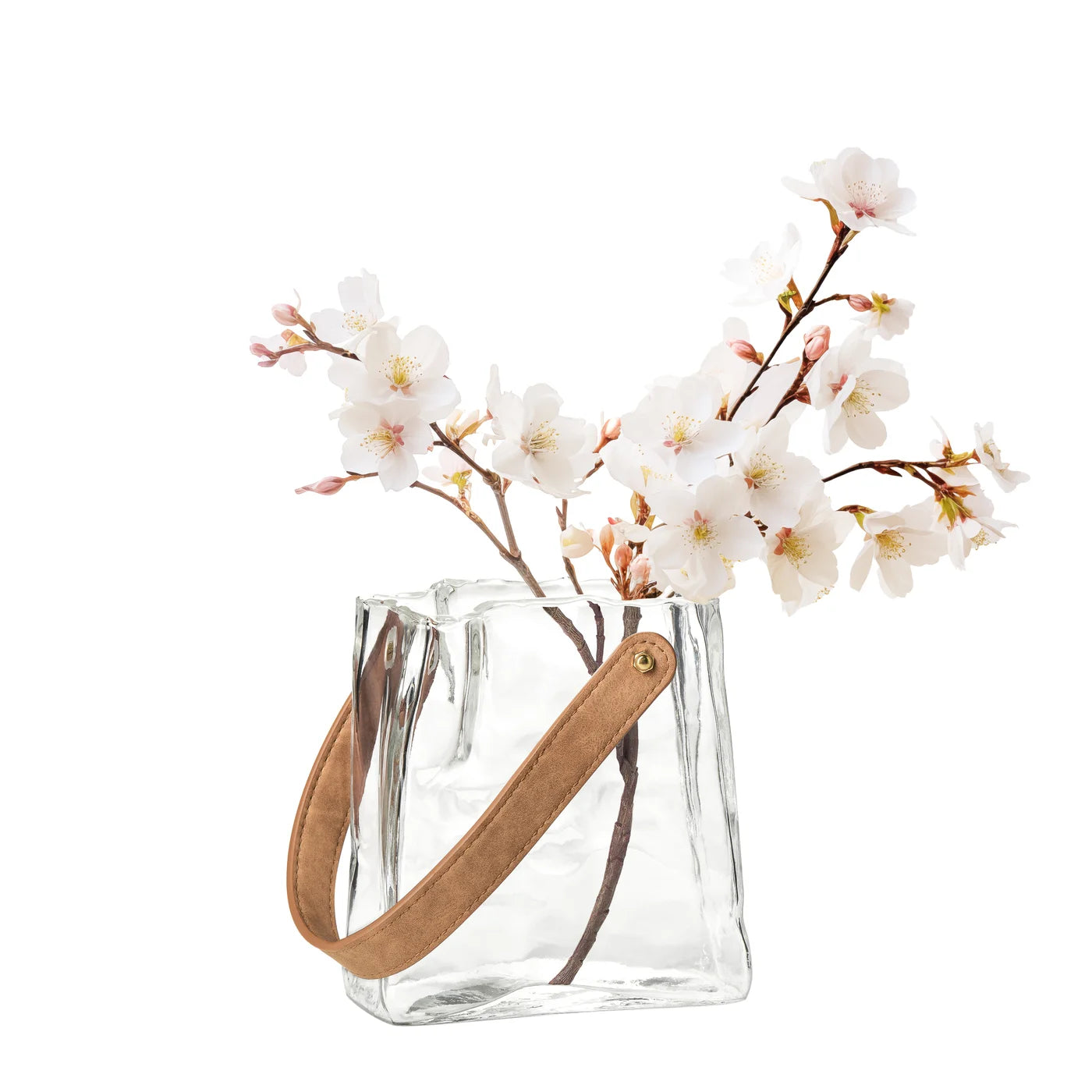 6.5 Inch tall clear glass vase shaped like a paper bag with faux leather holding white flowers.