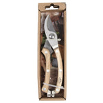 Gardening shears in a cardboard packaging on a white background