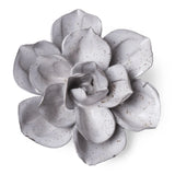 A ceramic Gardenia sculpture in a speckled light gray glaze, photographed from a top-down angle on a solid white background.