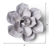 A large sculptural flower wall decor piece in a light gray glaze with brown speckles, shown on a white background with dimension lines indicating a height and width of 3 inches.