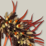 Decorative wreath with autumnal elements on a light gray background