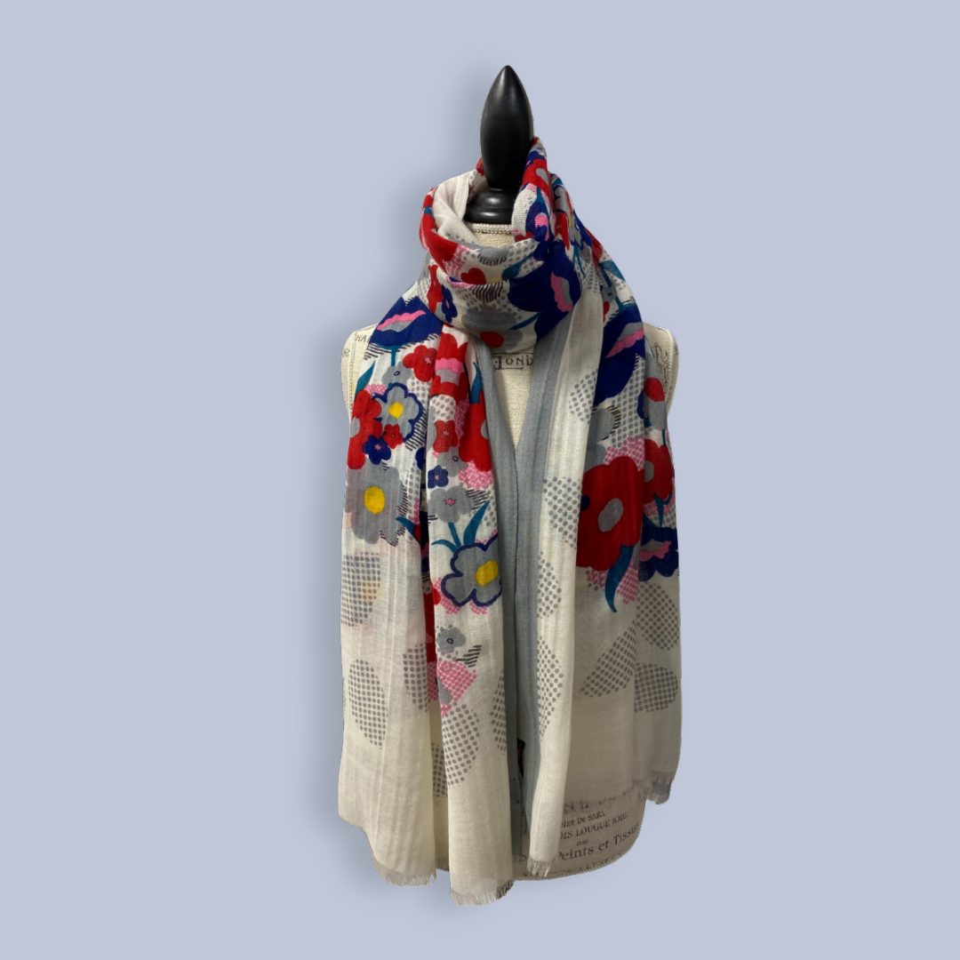 Colorful floral-patterned scarf on a mannequin against a light gray background