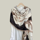 Floral patterned scarf draped over a white linen shirt.