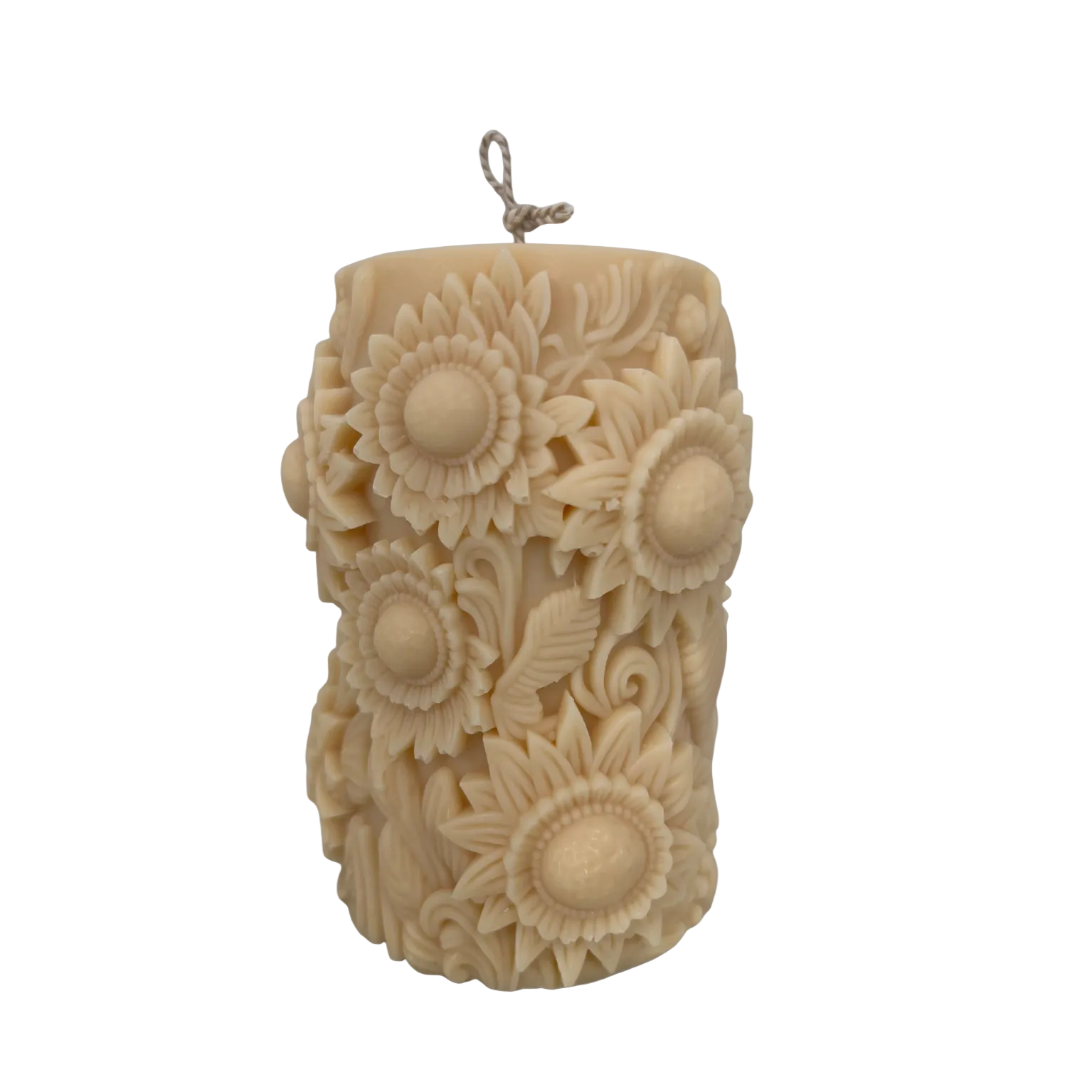 Decorative candle embossed with sunflowers with a light grey background