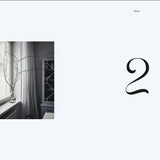Page from a book or magazine with a number '2' and a small inset image of a room with a window and plant.