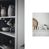 Cabinet with decorative items and a small inset photo of a similar setup.