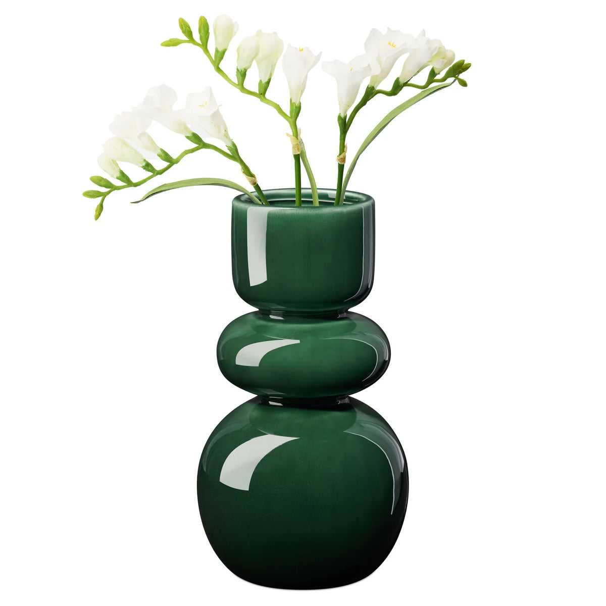 Deep glossy green vase with sleek bulb shape holding white flowers on a white background.