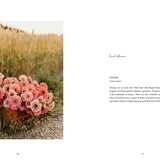 Pink flowers in a basket on a grassy field with text on a white background