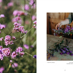 Floral arrangement with a blurred background of pink flowers and a person arranging flowers.