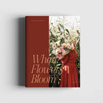 Book cover with a woman holding flowers and text 'Where Flowers Bloom' on a white background