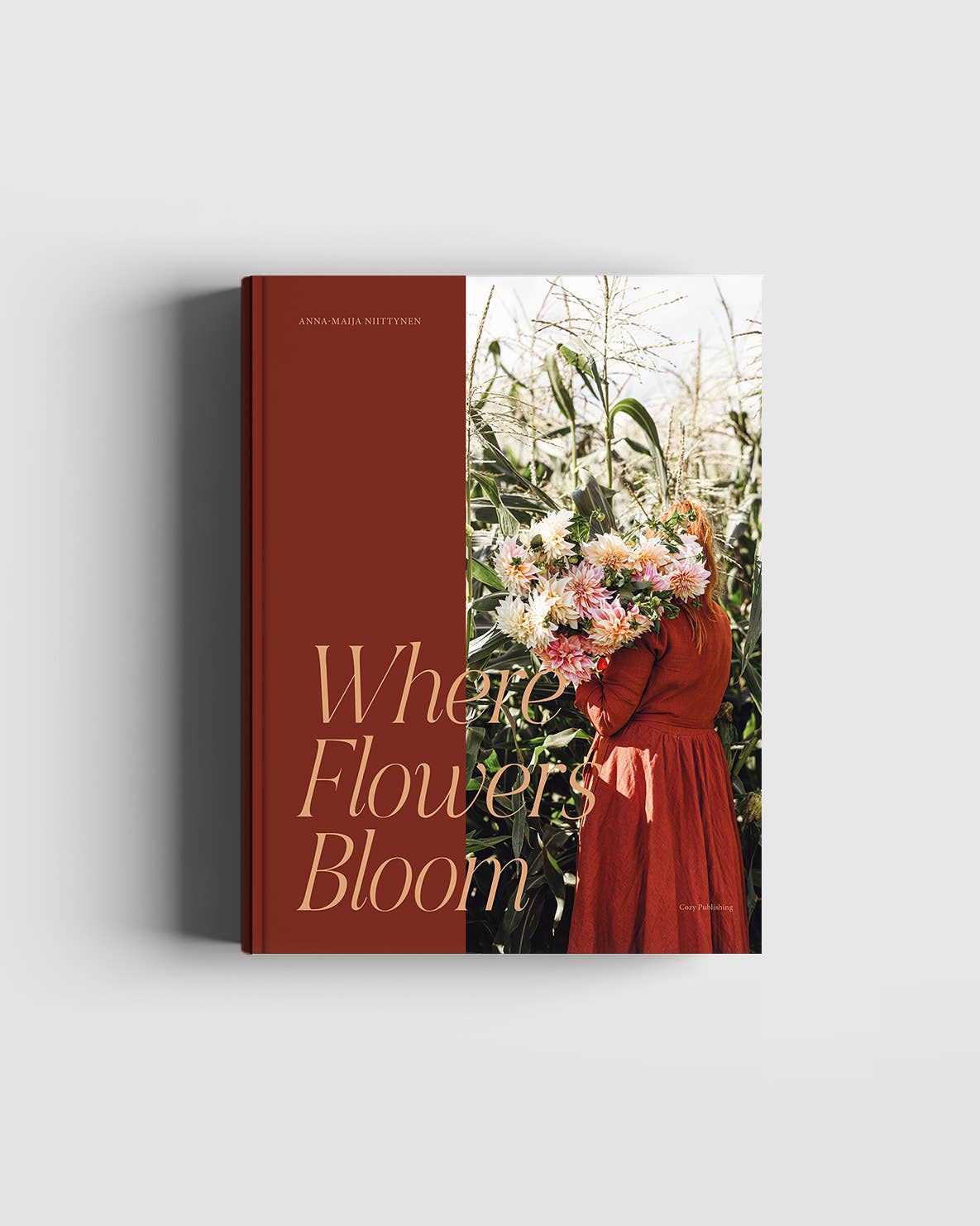 Book cover with a woman holding flowers and text 'Where Flowers Bloom' on a white background