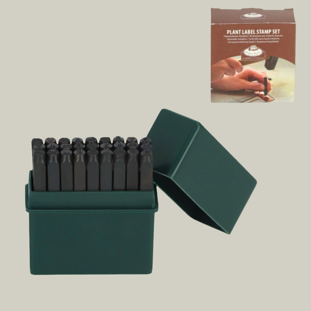 Set of plant label stamps in a green box with packaging inset showing usage.