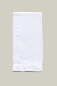 White folded napkin on a light gray background
