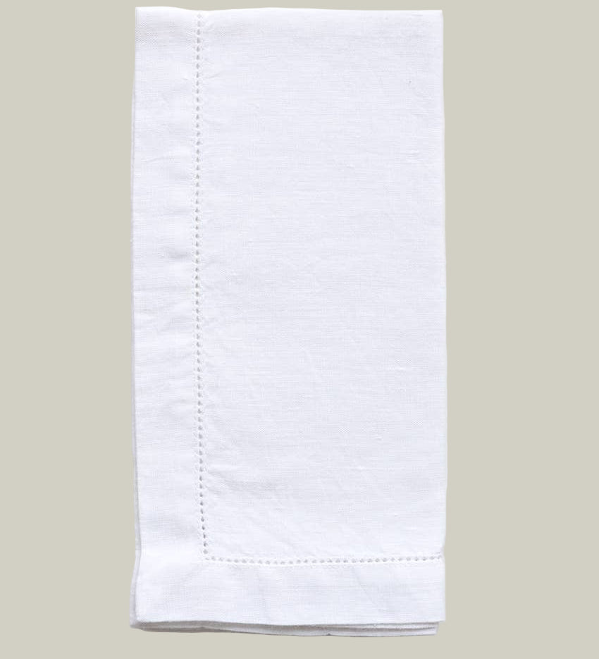 White folded napkin on a light gray background