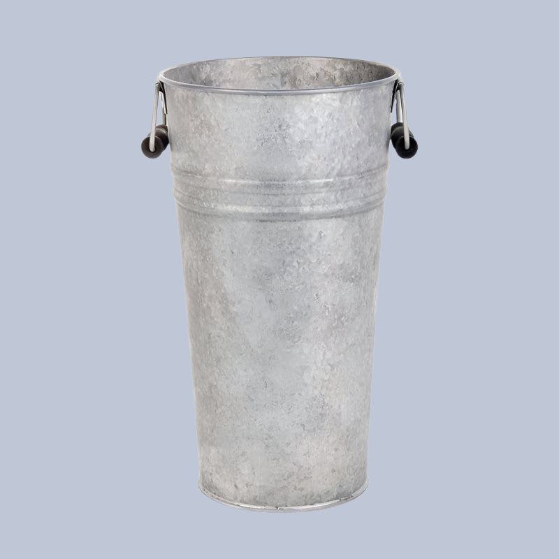 Metal bucket with handles on a light blue background