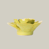 The side view of a green ceramic stargazer lily sculpture