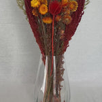 Bouquet titled "Autumn Ember Bouquet" is designed to be a magnificent focal point, perfect for a large vase on a dining table, an entryway, or a mantelpiece. 