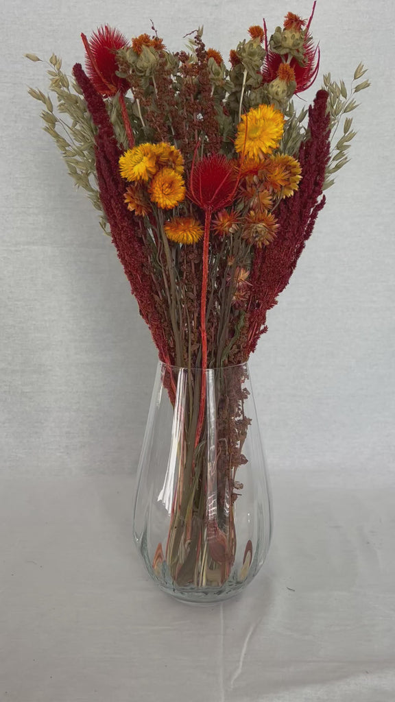 Bouquet titled "Autumn Ember Bouquet" is designed to be a magnificent focal point, perfect for a large vase on a dining table, an entryway, or a mantelpiece. 