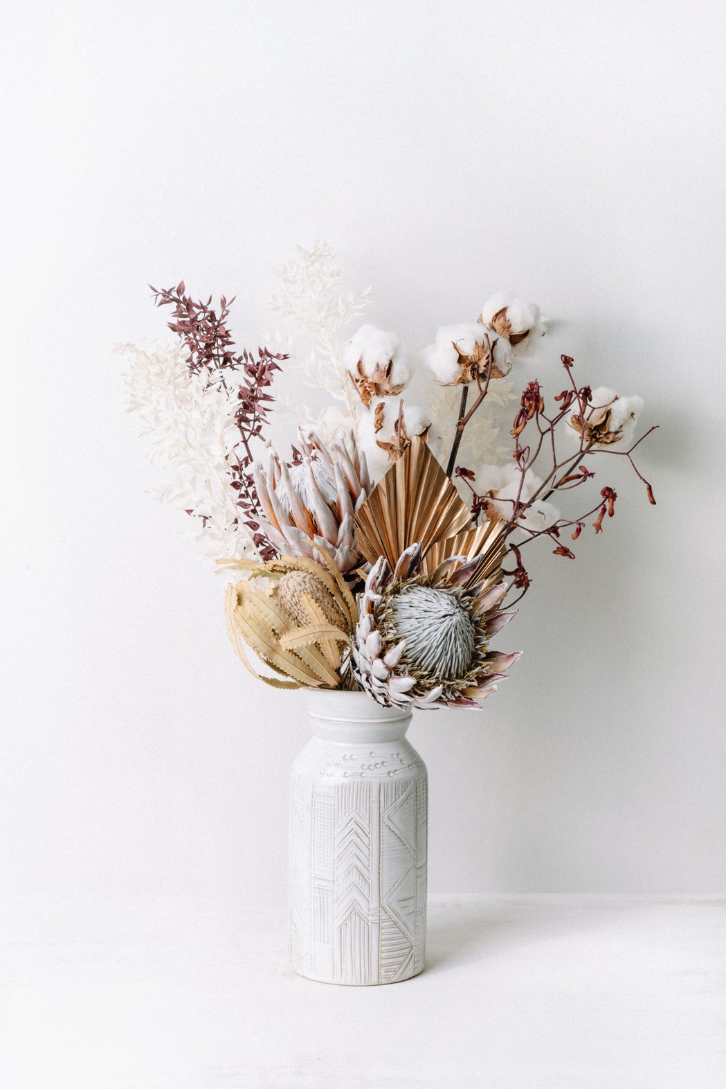 Dried flower arrangement in a vase.